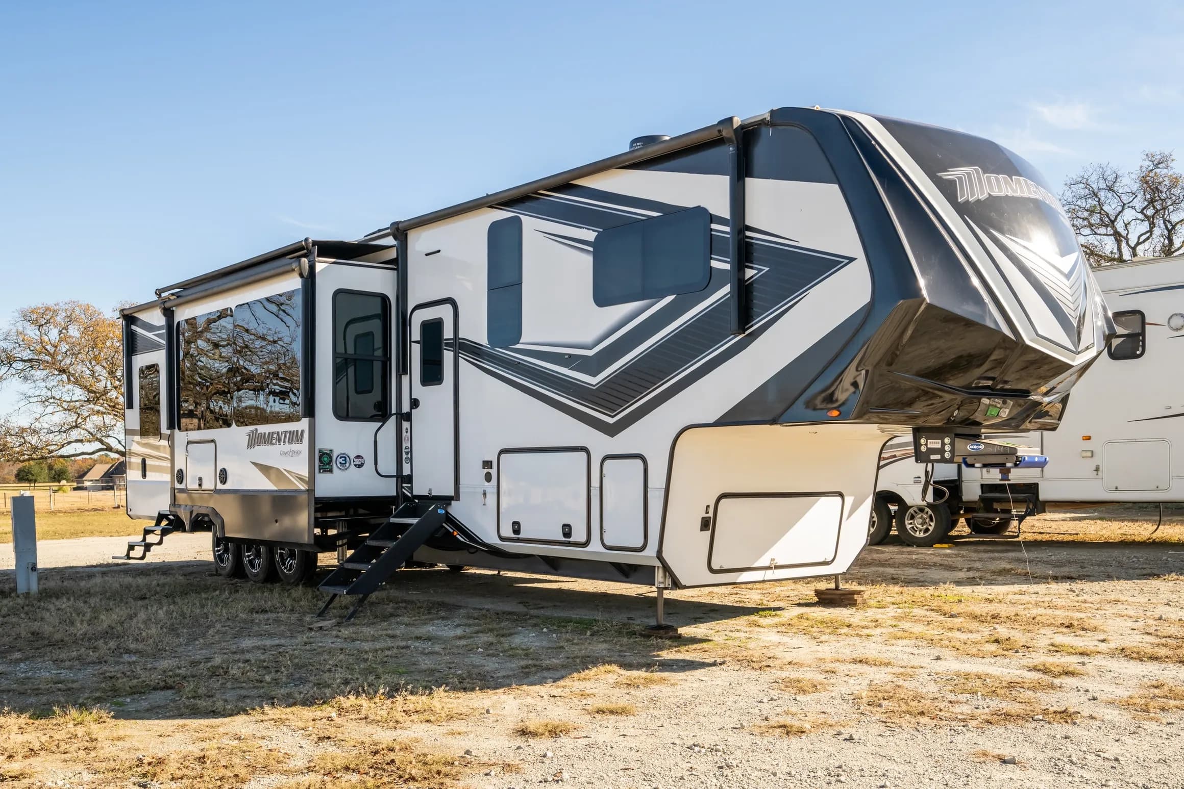 Triple W toy hauler parked at a campsite