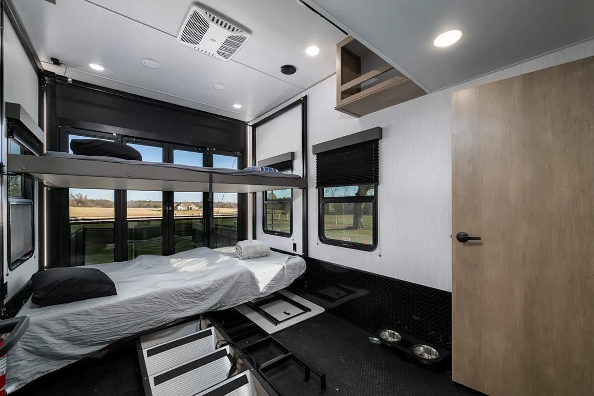 Toy hauler garage area set up with bunk beds